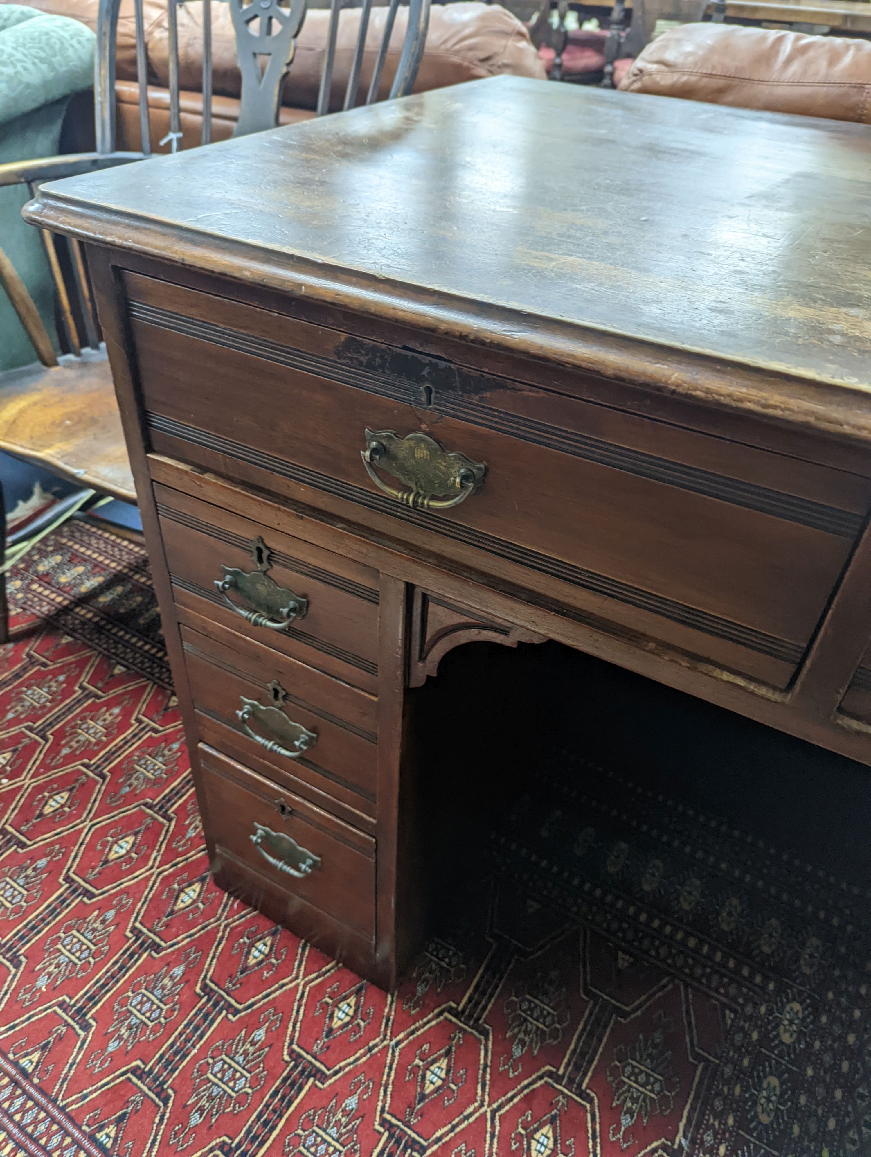 A late Victorian mahogany kneehole desk, length 107cm, height 80cm